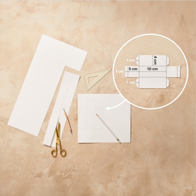 Step 1: An image showing a paper templates for an Easter basket and handles/ears.