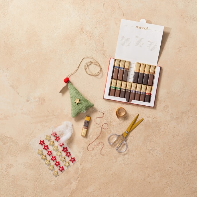Step 5 of the tutorial: All completed pouches are arranged on a flat surface with chocolates ready to be inserted, showcasing the final preparation step before assembly.
